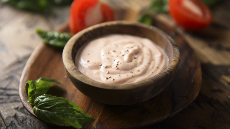 Wooden bowl of sriracha aioli 