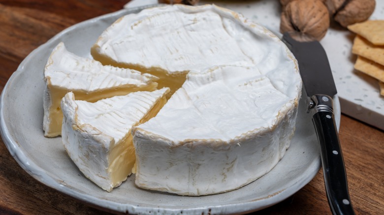 Camembert on plate with knife