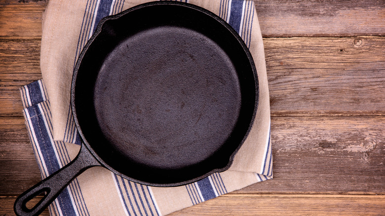 cast iron skillet on towel