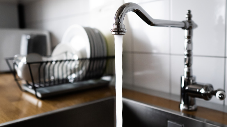 Water pouring out of a tap