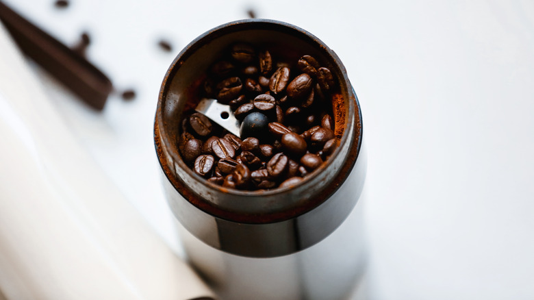 coffee grinder caked with residue