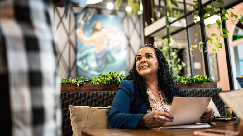 Woman ordering food at restaurant