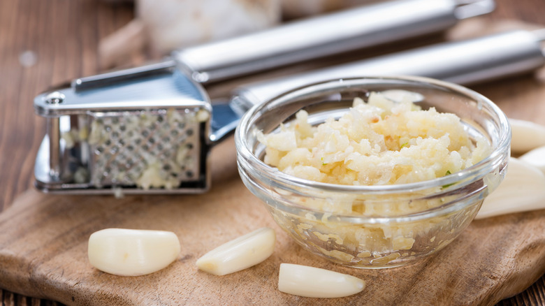 glass bowl of crushed garlic