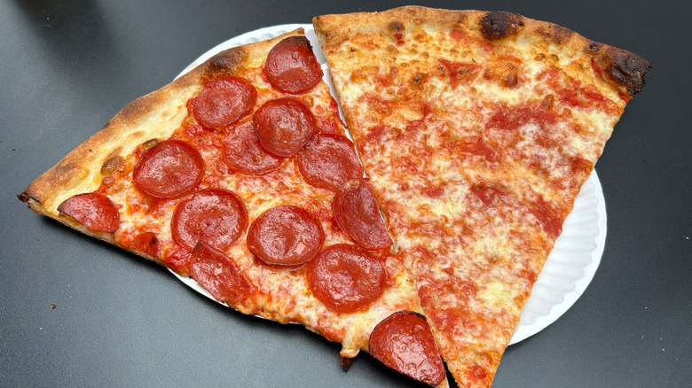 New York style slices of pepperoni pizza and plain pizza side by side