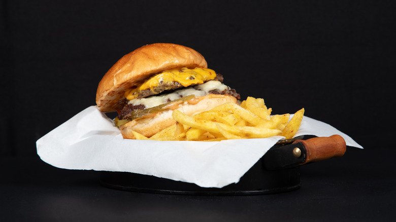 close up of cheeseburger and fries