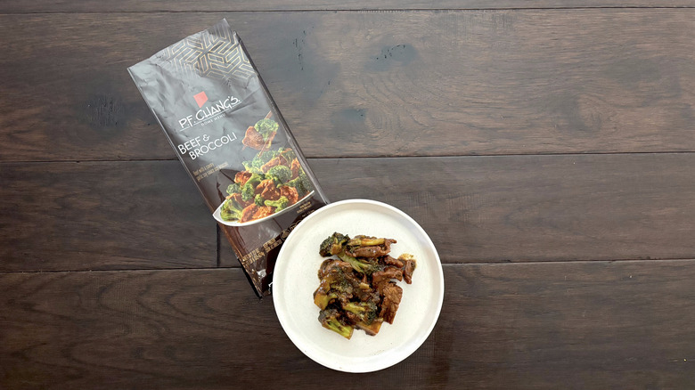 P.F. Chang's frozen beef and broccoli served on a white plate and a brown table