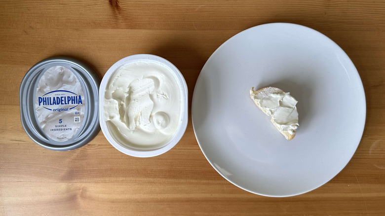 Original cream cheese is shown on a bagel and in the container.