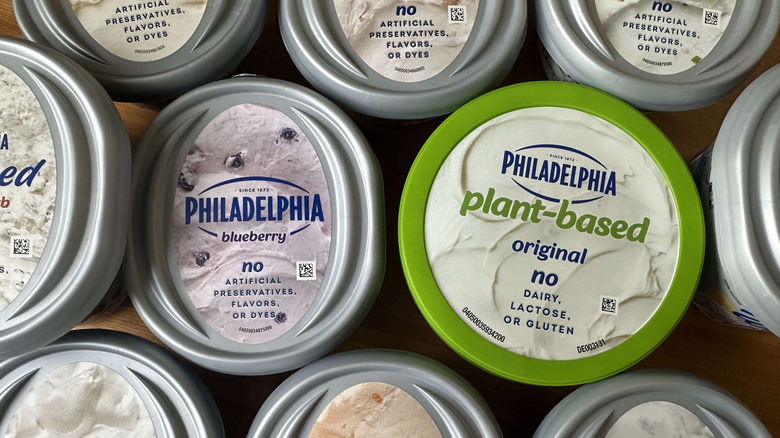 Philadelphia cream cheeses are shown from above in their containers.