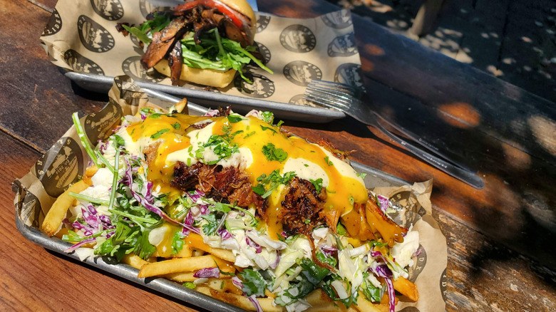PDX Sliders Burlington loaded fries on a table outside.
