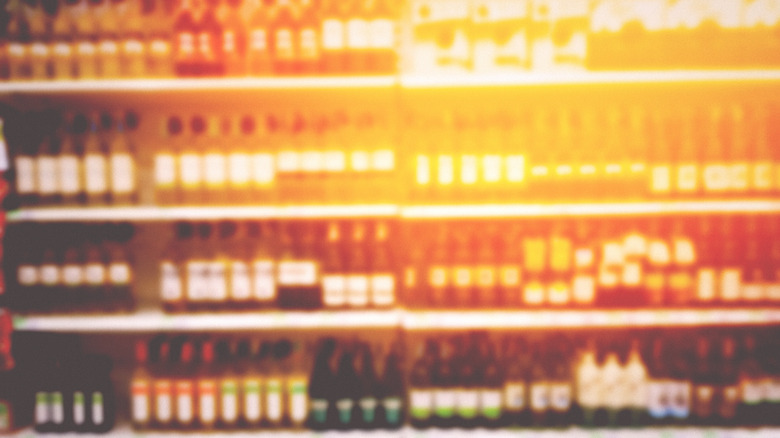 wine on shop shelf, blurry image