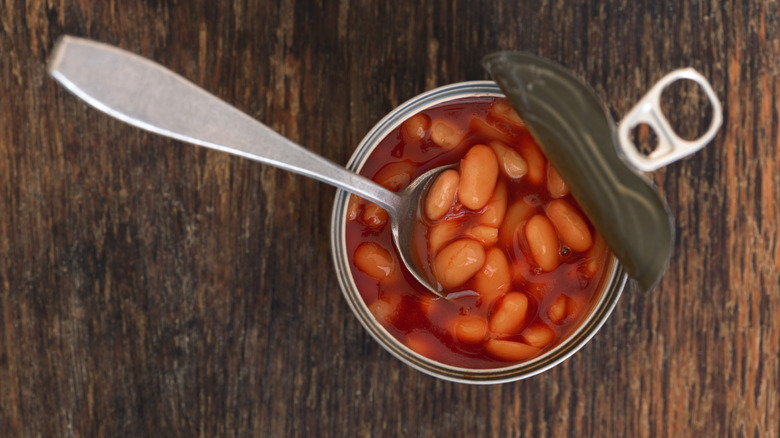 Canned beans open with spoon