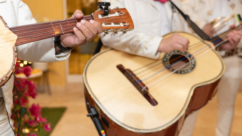 Mariachi performers playing guitars