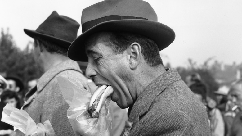 Humphrey Bogart enjoying a sandwich