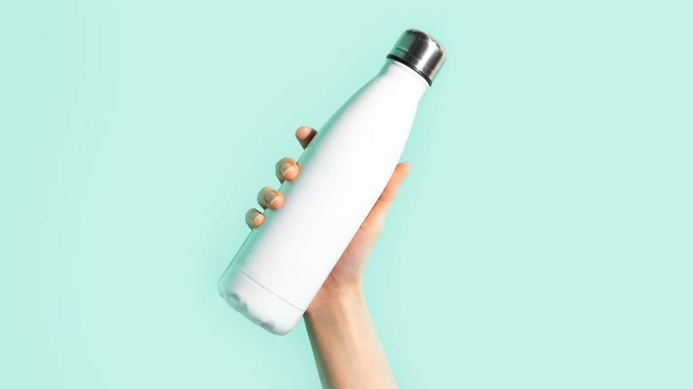 Reusable water bottle in hand