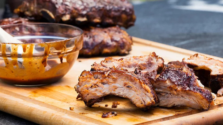 barbecued ribs on cutting board