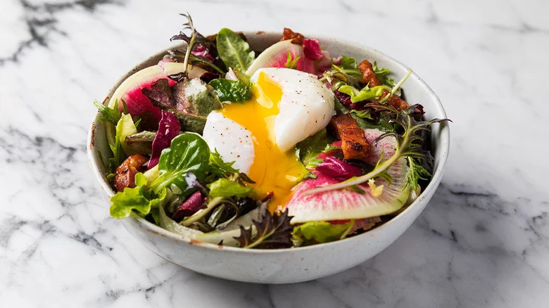 poached egg on salad