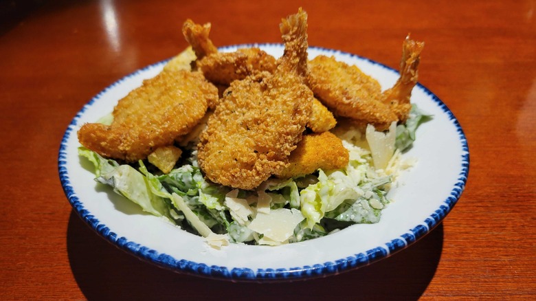 Caesar salad with breaded shrimp