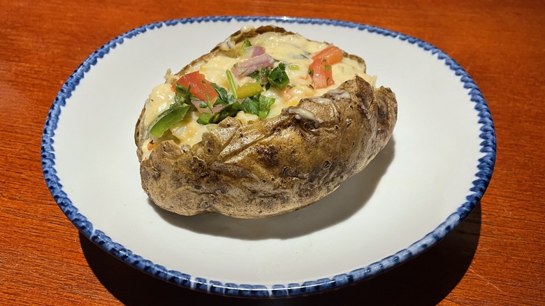 Baked potato with langoustine artichoke filling