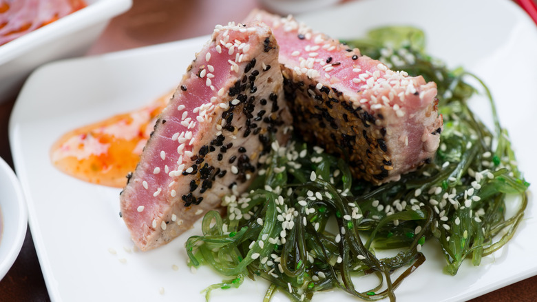 Sesame-crusted tuna served with a seaweed salad