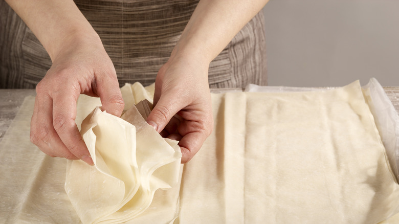 Phyllo dough with hands