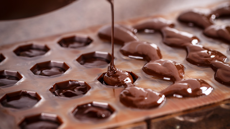 Pouring chocolate into mold