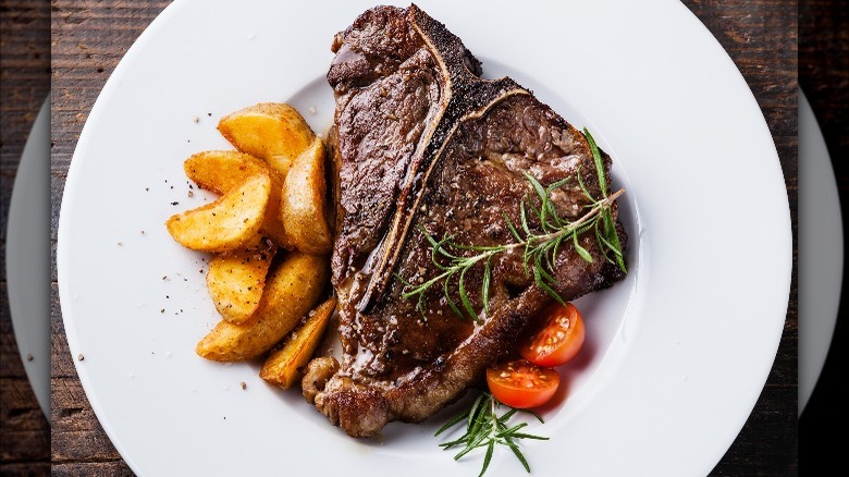 grilled t-bone steak and roasted potatoes