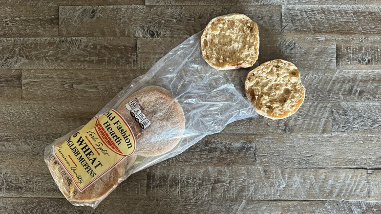 Old Fashion Hearth english muffins in and out of the package on a wooden table