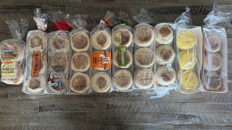 English muffin brands in their packaging laid out on wooden table