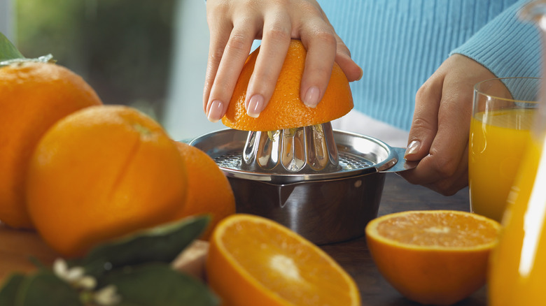 Squeezing fresh orange juice