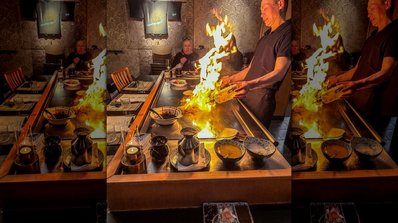 teppanyaki chef doing tricks on the flat top grill