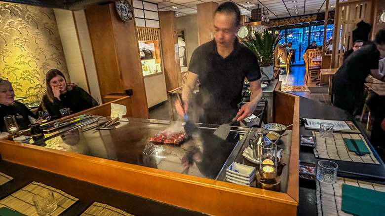 teppanyaki chef behind the grill