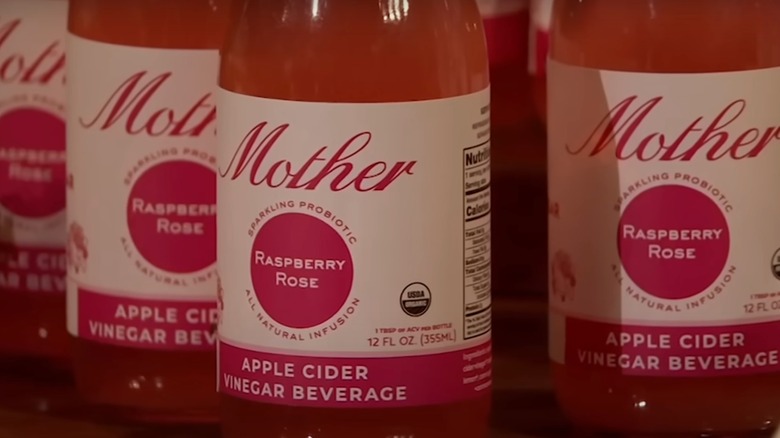 bottles of mother beverage in raspberry rose flavor
