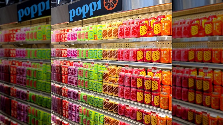 large amount of Poppi soda on display at a grocery store