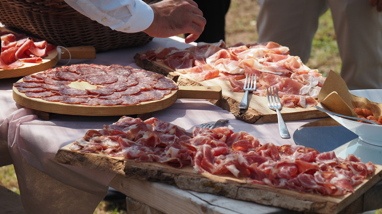 pancetta and other charcuterie on a rustic table