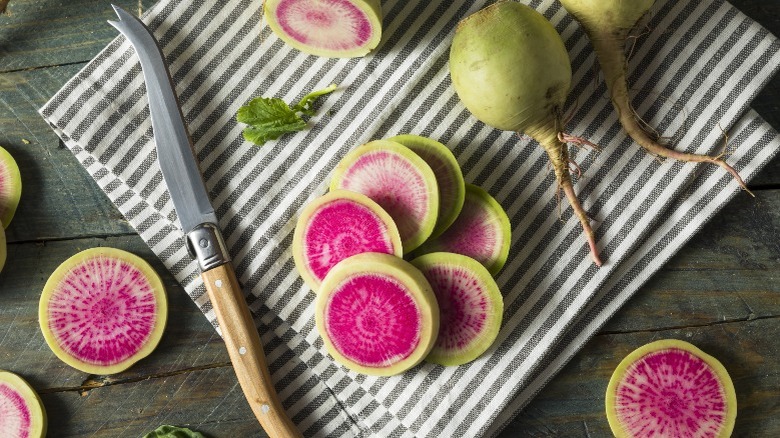 Sliced watermelon radishes on counter