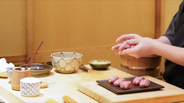 Omakase chef preparing nigiri