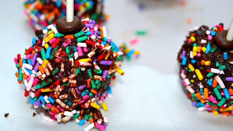 Closeup of chocolate cake pops with sprinkles standing