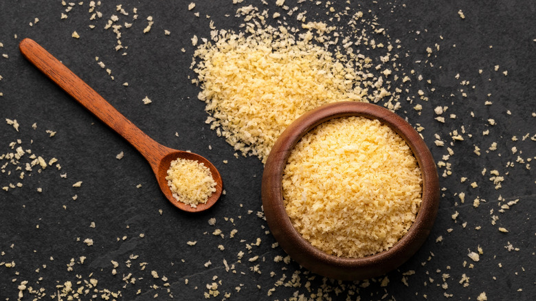 Panko breadcrumbs spilling out of wooden bowl