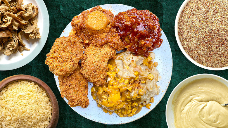 Vegan fried chicken with sauce and sides