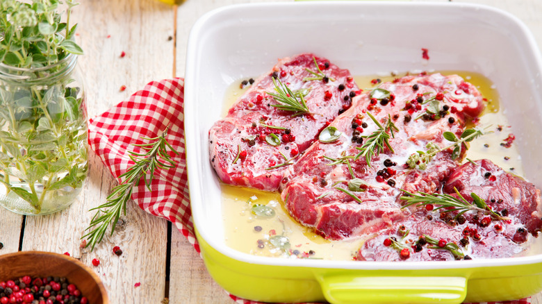 Marinating steaks with herbs