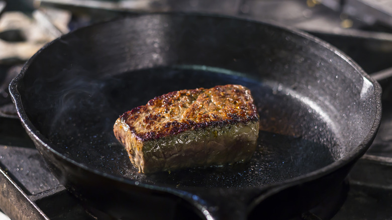 A steak seaing in pan