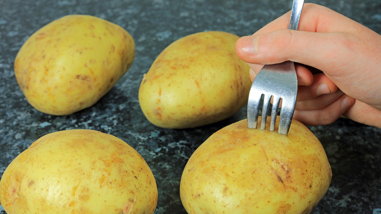 fork pricking potato