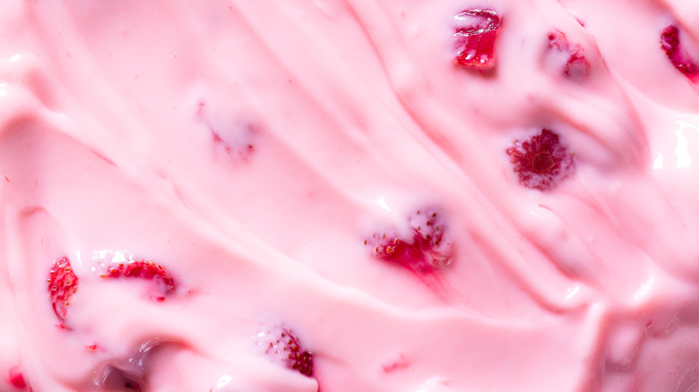 pink frosting with strawberry pieces