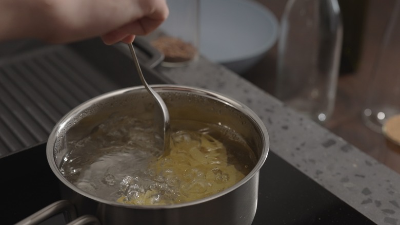 Noodles boiling in water