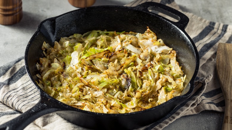 Sauteed cabbage and onion in pan