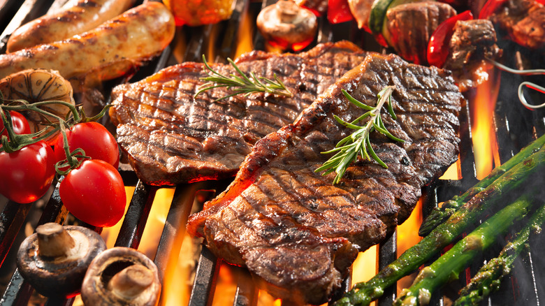 Steaks and vegetables on grill