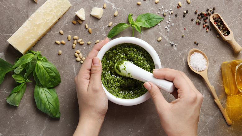 person making pesto