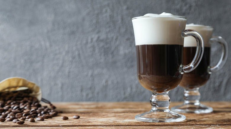 Two Irish coffees in glass mugs