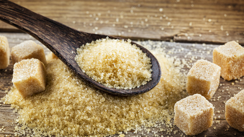 Pile and spoon of brown sugar