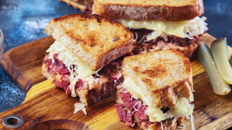 Reuben sandwich on wooden board 